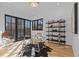 Bright office space with a modern desk, decorative rug, and natural light from the windows at 2010 S Clarkson St, Denver, CO 80210