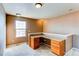 Built-in desk in an office with a window at 12754 Jasmine St # A, Thornton, CO 80602