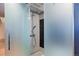 Modern bathroom featuring a glass-enclosed shower with sleek fixtures and contemporary tile work at 3377 Blake St # 205, Denver, CO 80205