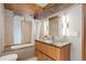 Modern bathroom featuring a soaking tub, a stone vanity, hardwood floors and a rain shower head at 3377 Blake St # 205, Denver, CO 80205