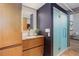 Stylish bathroom with modern vanity and walk-in shower at 3377 Blake St # 205, Denver, CO 80205