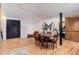 Spacious dining room with wood floors and access to hallway, kitchen, and open areas at 3377 Blake St # 205, Denver, CO 80205