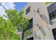 Exterior architecture showcasing the building's corrugated metal siding and satellite dishes at 3377 Blake St # 205, Denver, CO 80205