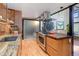 Modern kitchen with stainless steel appliances and butcher block island at 3377 Blake St # 205, Denver, CO 80205