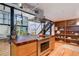 Bright and modern kitchen with stainless steel appliances, center island, and open layout at 3377 Blake St # 205, Denver, CO 80205
