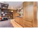Well-designed kitchen featuring stainless steel appliances and sleek wooden cabinetry and hardwood floors at 3377 Blake St # 205, Denver, CO 80205