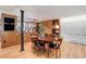 Kitchen, dining room with wood floors and modern lighting at 3377 Blake St # 205, Denver, CO 80205