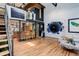 Spacious open-concept living room with modern design and unique artworks at 3377 Blake St # 205, Denver, CO 80205