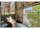 Enclosed patio with city views, a bike, and cozy seating at 3377 Blake St # 205, Denver, CO 80205