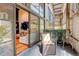 This covered patio features comfortable seating with views of the interior and city at 3377 Blake St # 205, Denver, CO 80205