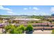 An aerial view of community featuring a lake and views of Denver in the distance at 1918 Depew St, Lakewood, CO 80214