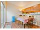 Dining area featuring wood flooring, a dining table with chairs, and a sliding glass door at 1918 Depew St, Lakewood, CO 80214