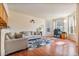 Bright and airy living room featuring hardwood floors, neutral walls, and large windows at 1918 Depew St, Lakewood, CO 80214