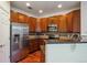 Updated kitchen featuring stainless steel appliances, granite countertops, and wood floors at 11391 Navajo Cir # B, Westminster, CO 80234