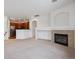 Bright living room with a fireplace and an open floor plan leading to the kitchen at 11391 Navajo Cir # B, Westminster, CO 80234
