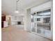 Open living area leading to a private balcony and featuring a fireplace at 11391 Navajo Cir # B, Westminster, CO 80234