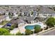 Overhead shot of neighborhood pool, clubhouse, landscaping, sidewalks, resident parking, and attractive buildings at 10381 Cook Way # 202, Thornton, CO 80229