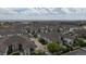 An aerial view of a neighborhood with multiple buildings, landscaping, and convenient parking in a desirable location at 10381 Cook Way # 202, Thornton, CO 80229