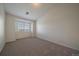 Bright bedroom with neutral carpet, white walls, and natural light from a window at 10381 Cook Way # 202, Thornton, CO 80229