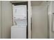 Laundry area with a stacked washer and dryer, along with a shower stall at 10381 Cook Way # 202, Thornton, CO 80229