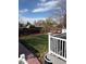 Expansive backyard with lush lawn, mature trees, and patio at 8757 W 75Th Way, Arvada, CO 80005