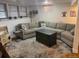 Spacious basement featuring a large sectional couch and an area rug at 8757 W 75Th Way, Arvada, CO 80005