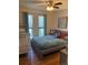 Cozy bedroom with a crib and large windows at 8757 W 75Th Way, Arvada, CO 80005