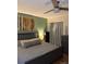 Cozy bedroom featuring a ceiling fan, decorative artwork, and soft, neutral decor at 8757 W 75Th Way, Arvada, CO 80005