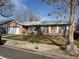 Charming single-story home featuring a well-maintained lawn and an attached two-car garage at 8757 W 75Th Way, Arvada, CO 80005