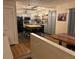 Open-concept kitchen with butcher block island, stainless appliances, and easy access to the dining area at 8757 W 75Th Way, Arvada, CO 80005