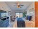 Bedroom featuring a comfortable bed, a ceiling fan, and a large window with neighborhood views at 494 Black Feather Loop # 117, Castle Rock, CO 80104
