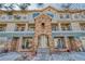 Charming townhome with stone accents, patios, and well-maintained landscaping at 494 Black Feather Loop # 117, Castle Rock, CO 80104