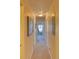 Hallway with carpet floors, neutral walls, and multiple doors leading to various rooms at 494 Black Feather Loop # 117, Castle Rock, CO 80104