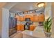 Well-equipped kitchen with stainless steel appliances, wooden cabinetry, and ample lighting at 494 Black Feather Loop # 117, Castle Rock, CO 80104