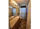 Cozy bathroom with vanity, mirror and blue patterned shower curtain at 221 Homestead Pkwy, Longmont, CO 80504