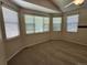 Bright bedroom with neutral carpeting and lots of natural light from multiple windows at 221 Homestead Pkwy, Longmont, CO 80504