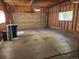 Spacious garage with wood paneling and concrete floor provides ample parking and storage at 221 Homestead Pkwy, Longmont, CO 80504