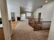 Open living room showcasing a fireplace, high ceilings, wood floors, and seamless flow at 221 Homestead Pkwy, Longmont, CO 80504