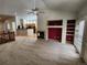 Open living space with a cozy fireplace, built-in shelving, and seamless flow to the kitchen at 221 Homestead Pkwy, Longmont, CO 80504