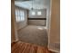 Neutral living room featuring large windows, plush carpeting, and ample space for relaxation at 221 Homestead Pkwy, Longmont, CO 80504