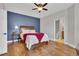 Cozy bedroom with hardwood floors, ceiling fan, and ensuite bathroom at 4822 Pathfinder Ct, Castle Rock, CO 80108