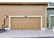 Tan garage door featuring the address of the home: 4822 at 4822 Pathfinder Ct, Castle Rock, CO 80108