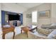 Second floor living room featuring tv, side tables and vaulted ceiling at 4822 Pathfinder Ct, Castle Rock, CO 80108