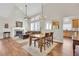 Spacious living and dining area with hardwood floors, fireplace, and open access to the kitchen at 4822 Pathfinder Ct, Castle Rock, CO 80108