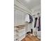Walk-in closet with custom shelves, drawers, and hanging rods for organized storage at 4822 Pathfinder Ct, Castle Rock, CO 80108