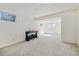 Bright basement with carpeted floors, piano, and a well-lit space, offering a versatile area for recreation or hobbies at 5895 S Killarney Way, Centennial, CO 80015