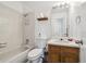 Functional bathroom with a tub and shower combination, vanity with mirror, providing a practical space at 5895 S Killarney Way, Centennial, CO 80015