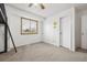 Bedroom with carpeted floors, loft bed, and a large window, providing a simple and functional space at 5895 S Killarney Way, Centennial, CO 80015