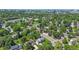 A scenic aerial shot showcasing the property's location within a verdant neighborhood with city views at 5081 S Emporia St, Greenwood Village, CO 80111