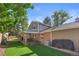 A well-maintained backyard boasting a covered patio and artificial turf lawn at 5081 S Emporia St, Greenwood Village, CO 80111